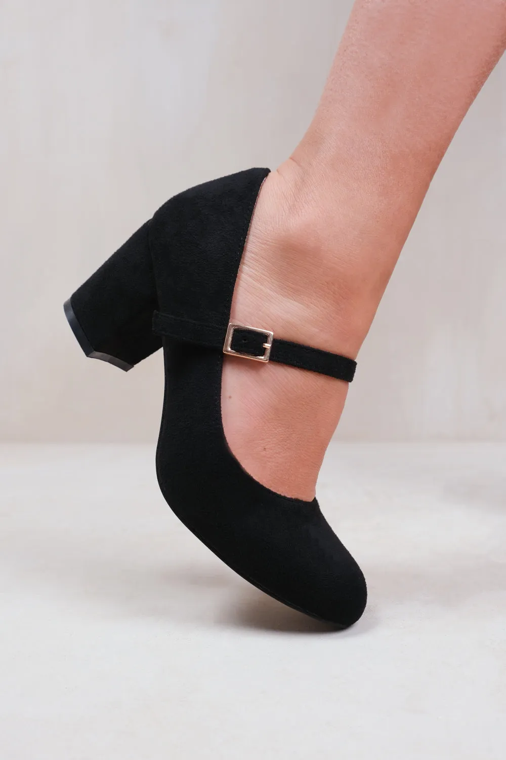 ARACELI BLOCK HEEL MARY JANE PUMPS IN BLACK FAUX SUEDE