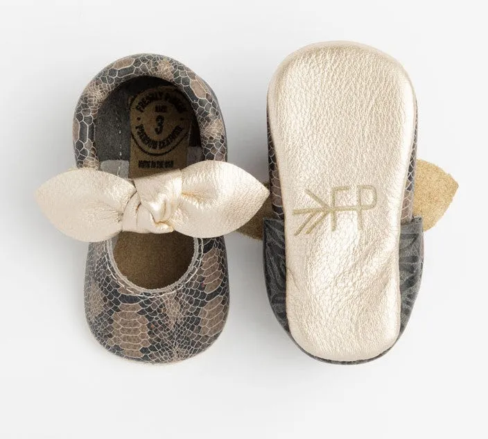 Freshly Picked Platinum Snakeskin Knotted Bow Soft Sole Moccasins